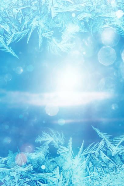 istock Winter sun - defocused blue background with ice flowers 1074168818