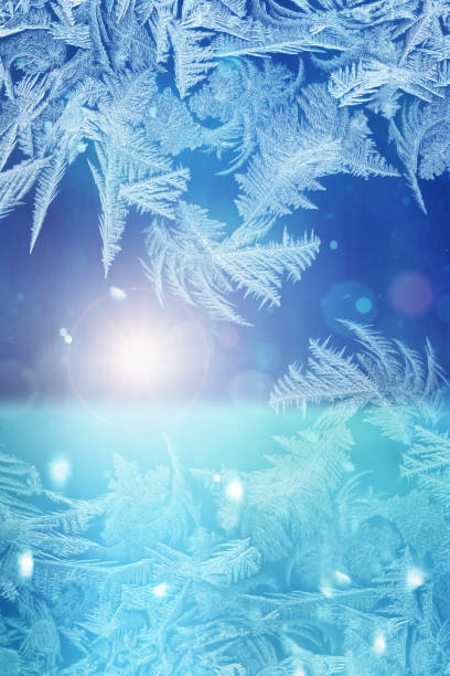 istock Winter sun - defocused blue background with ice flowers 1074168834