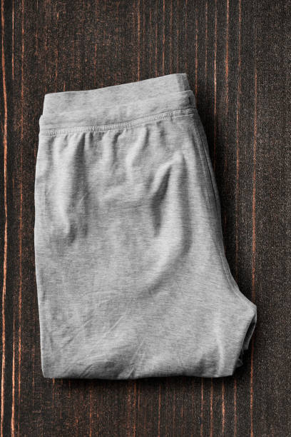 istock Pants on wooden background 1074169742