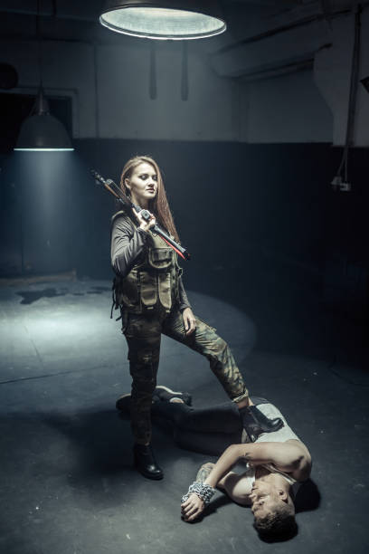 istock Woman soldier and her Victim 1074171902