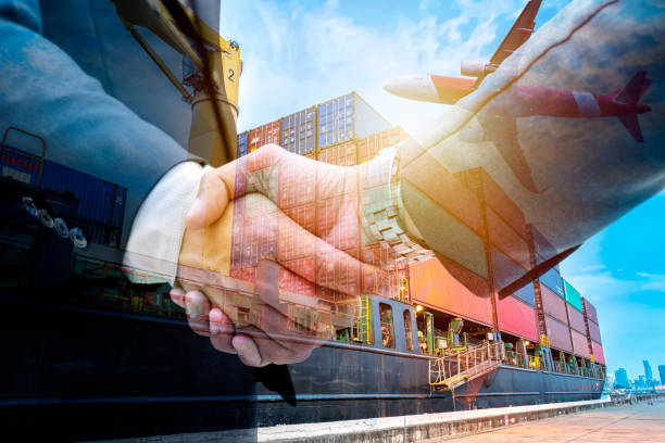istock Double exposure business shake hand with Container warehouse background for delivery shipment transport. 1074173568