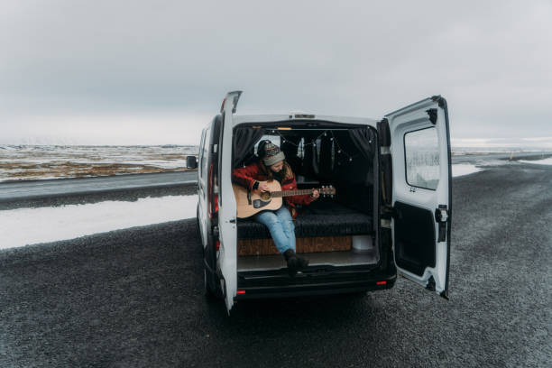 istock Woman playing guitar  in camper van 1074177072