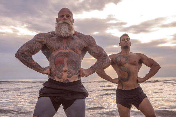 istock Tattooed Senior Man coaching young man During Workout 1074178302