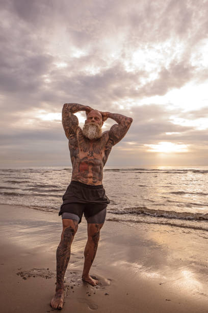 istock Tattooed Senior Man During Workout 1074178330