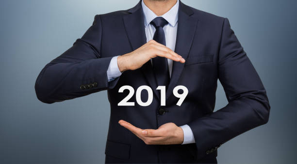 istock 2019 Christmas Businessman Holding in Hand New technologies 1074178422