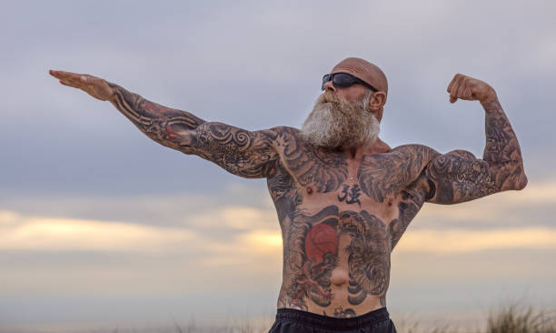 istock Tattooed Senior Man During Workout 1074179432