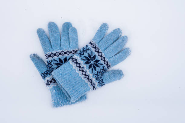 istock Winter wool gloves lie on the snow outside. 1074182876