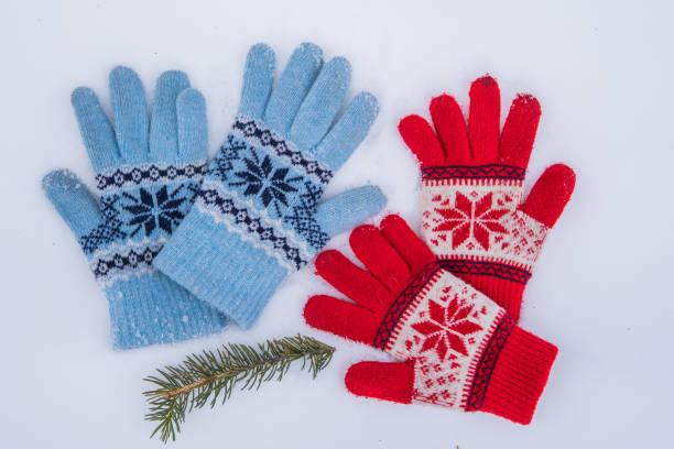istock Winter wool gloves lie on the snow outside. 1074182894