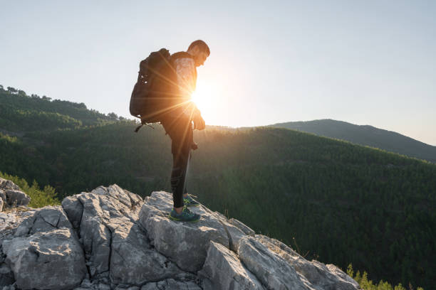 istock Hiker on top of mountains enjoy sunrise 1074183042
