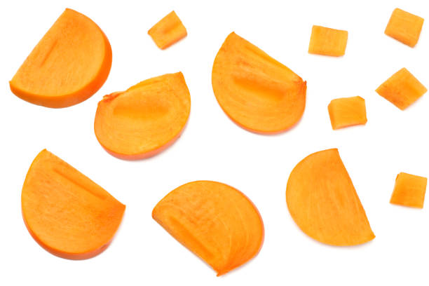 istock fresh ripe persimmon slices isolated on white background. top view 1074183232