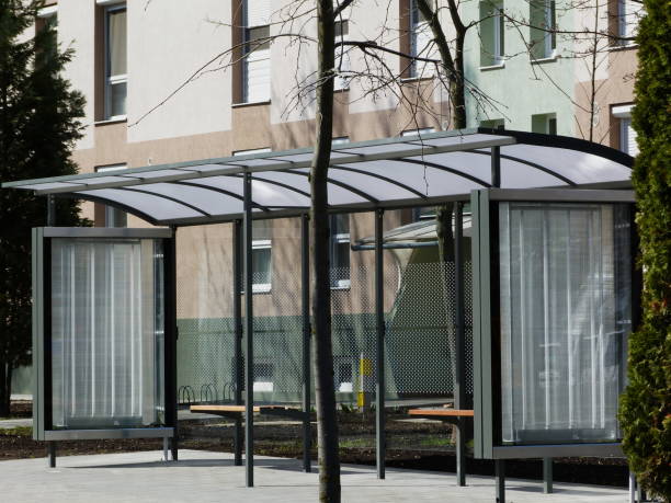 istock modern glass bus shelter in urban setting 1074187330