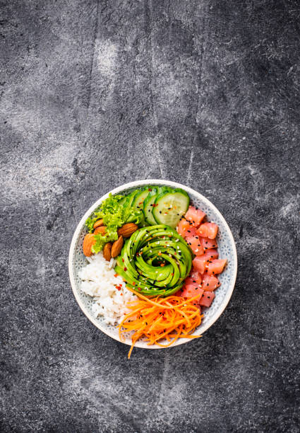 istock Hawaiian poke bowl with salmon, rice and vegetable 1074194478