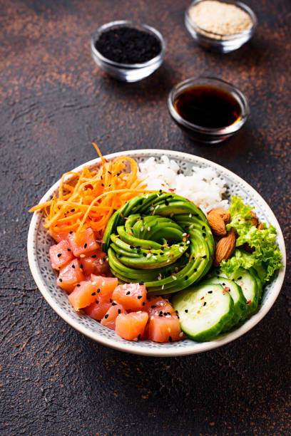 istock Hawaiian poke bowl with salmon, rice and vegetable 1074194502