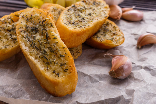 istock fragrant garlic bread on a rustic wooden background 1074195126