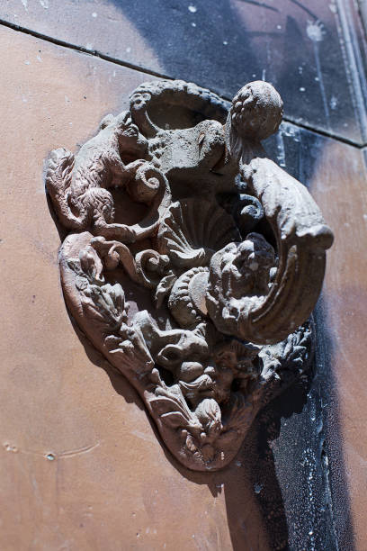 istock Ornate old wrought iron door knocker 1074195338