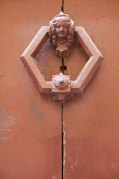 istock Ornate old wrought iron door knocker 1074195372