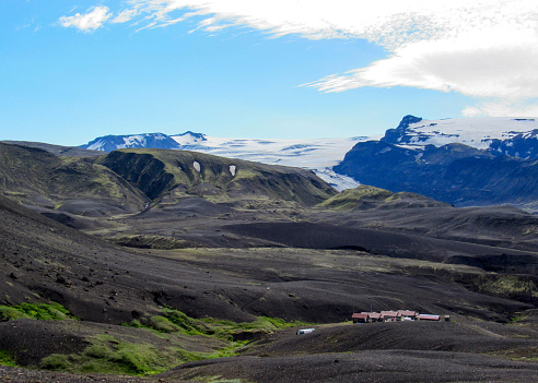 Stunning landscape of volcanic terrain with Myrdalsjokull ice cap in Katla caldera, view from Botnar-Ermstur hut campsite, Laugavegur Trail from Thorsmork to Landmannalaugar, Highlands of Iceland