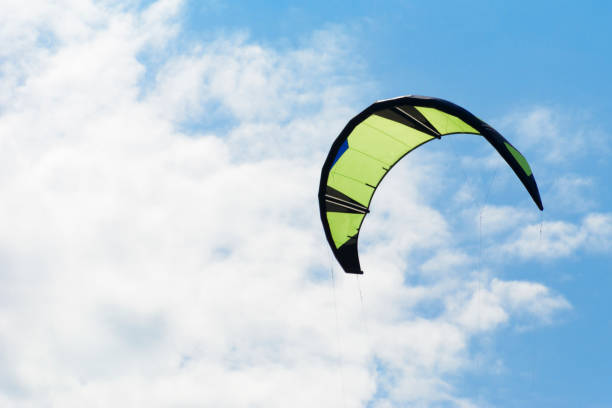 istock Kiteboarding kite close-up blue sky with clouds in background. 1074197262