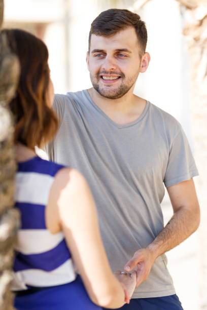 istock Happy man and girl talking and hugging 1074199102