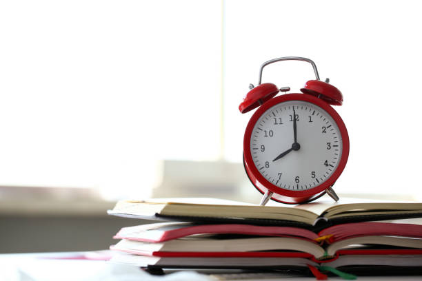 istock Red alarm clock set at eight in the morning 1074200100