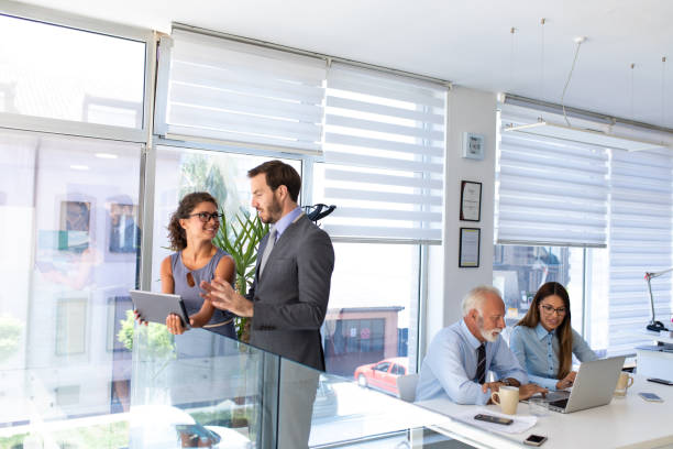 istock Business people multi-tasking in the office 1074202340