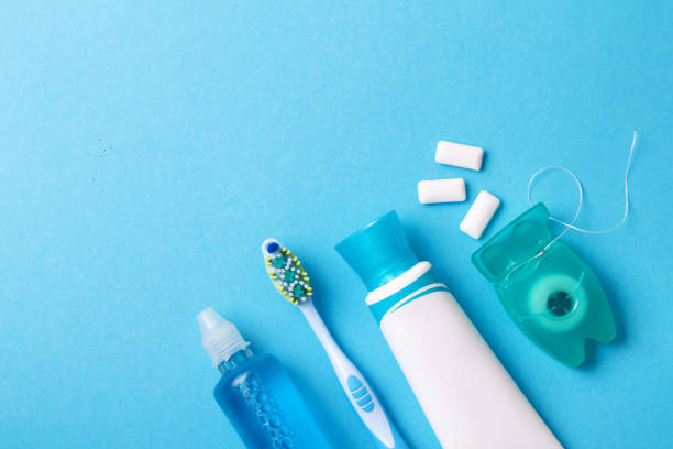 istock Tools for dental care: orthodontic brush, floss, toothpaste. Invisible dental aligners modern tooth brackets transparent braces to straighten teeth in cosmetic dentistry and orthodontics 1074208810