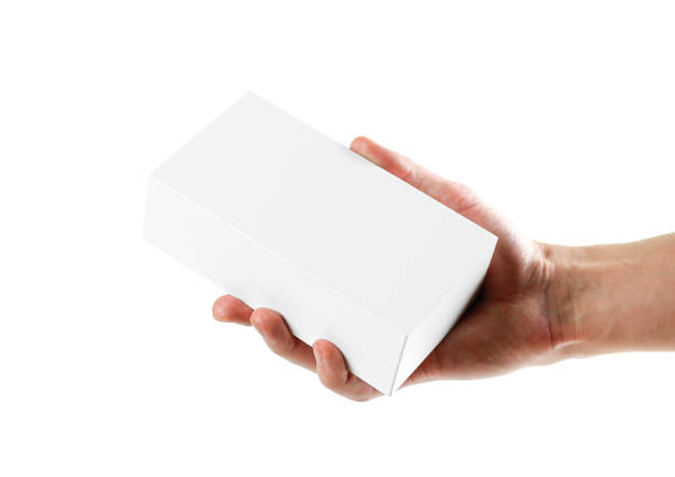 istock Hand holding white box. Close up. Isolated on white background. 1074211540