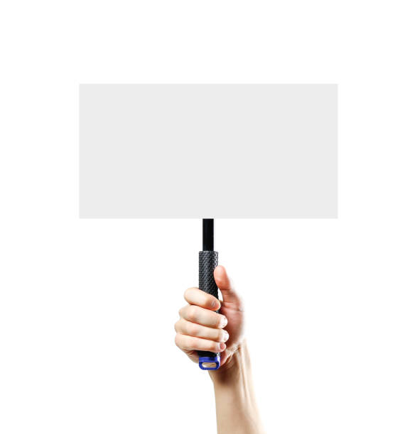 istock Hand holding a white blank plate with a handle. Close up. Isolated on white background. 1074211566
