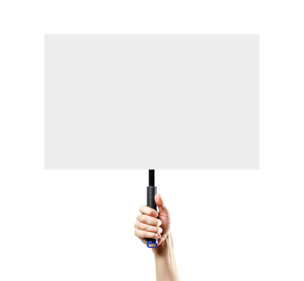 istock Hand holding a white blank plate with a handle. Close up. Isolated on white background. 1074211580