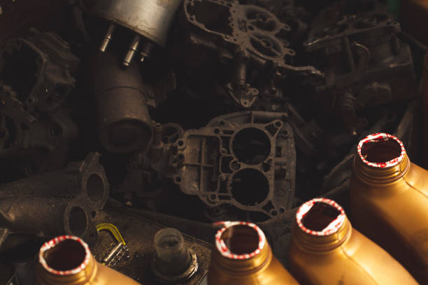 Old rusty car parts and oil waste