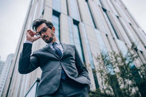 istock Businessman standing outdoors looking worried 1074213220