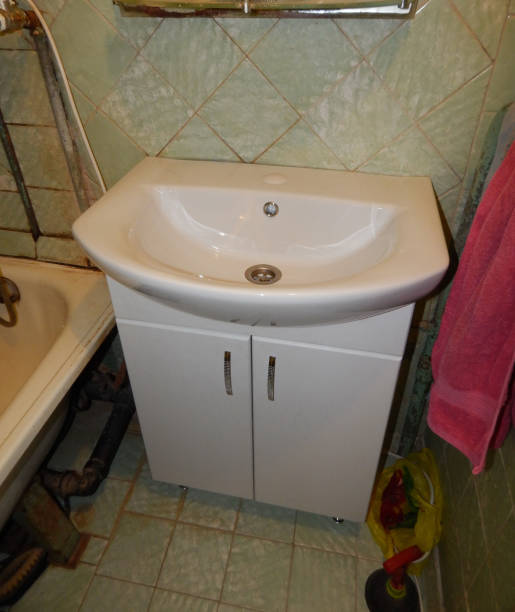 istock Installing the sink, dismantling and laying sewer pipes 1074216168