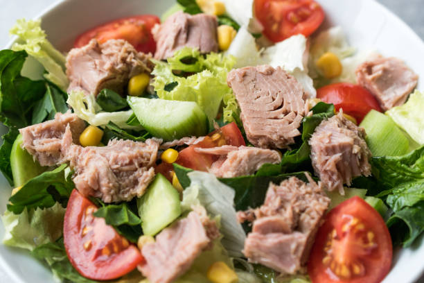 istock Tuna Fish Salad with Lettuce, Cherry Tomatoes, Cucumber and Corn. 1074219368