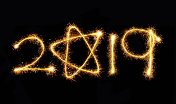 istock 2019 written with a sparkler on a black background 1074220126