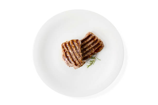 istock Two steaks and rosemary on a white background. 1074222062