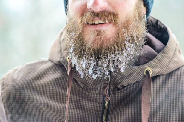 istock Smiling young man with beard in icicles 1074224586