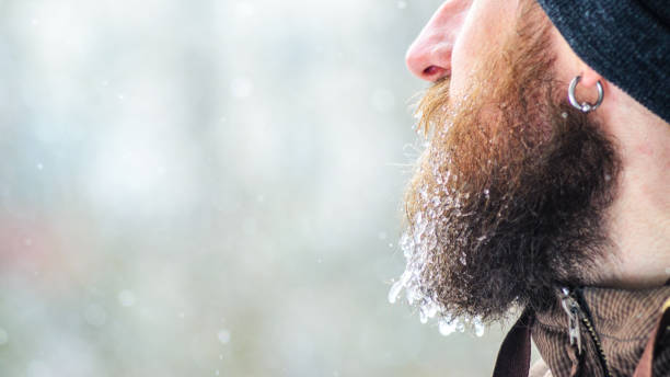 istock Icicles on a beard. Male portrait in profile 1074224612
