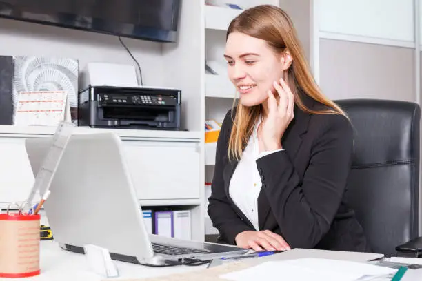 Photo of Salesgirl using laptop