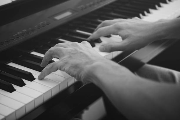 istock Pianist playing on a digital piano 1074227094