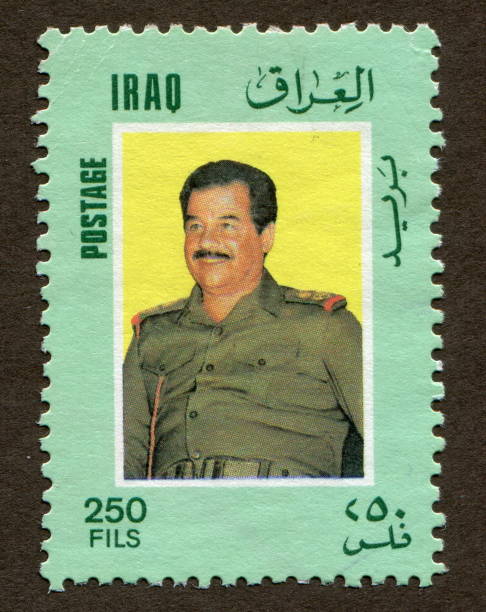 ирак штамп: бывший президент ирака - саддам хусейн - marshal arts стоковые фото и изображения