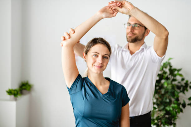 istock A Modern rehabilitation physiotherapy man at work with woman client 1074230848