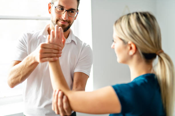 istock A Modern rehabilitation physiotherapy man at work with woman client 1074230968