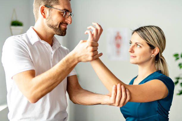 istock A Modern rehabilitation physiotherapy man at work with woman client 1074230978