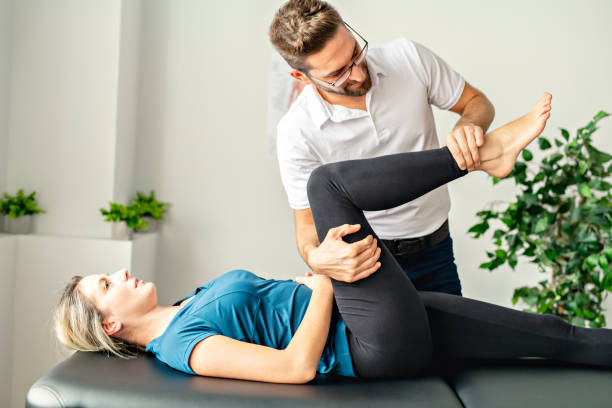 istock A Modern rehabilitation physiotherapy man at work with woman client 1074232014
