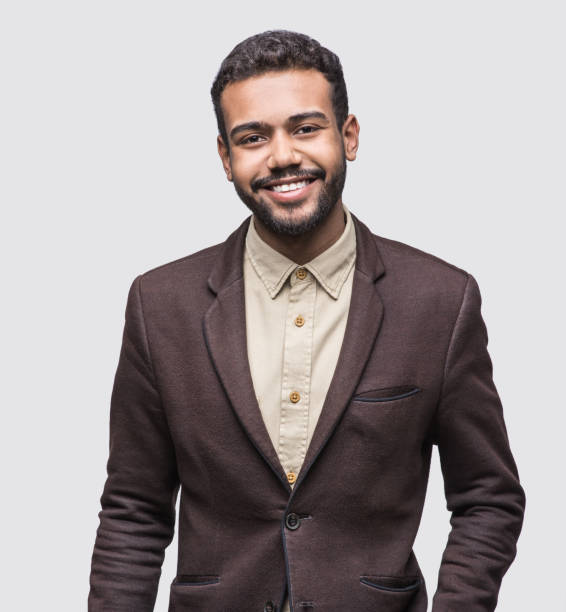 istock Portrait of handsome smiling young man studio shot 1074234610