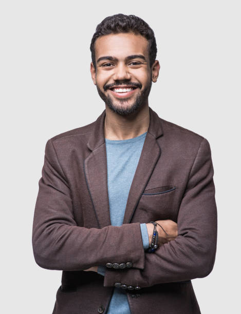 istock Portrait of handsome smiling young man with folded arms 1074234670
