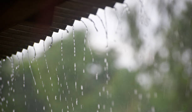 istock Blurry falling rain waters isolated unique photo 1074236430