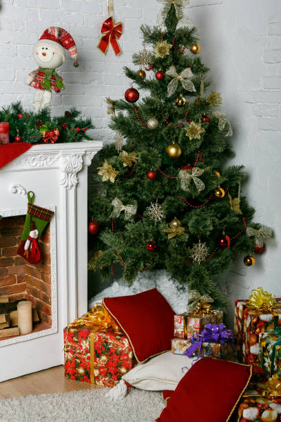 istock Image of chimney and decorated Christmas tree with gift 1074239218