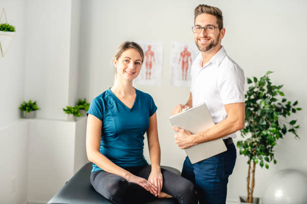 istock A Modern rehabilitation physiotherapy man at work with woman client 1074239226