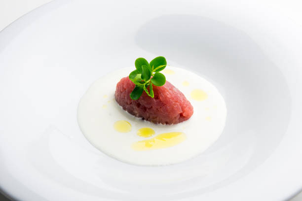 istock Dish with raw red tuna quenelle on cream cheese 1074240724